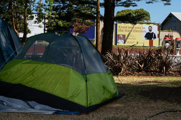 A tent is pitched in a public park